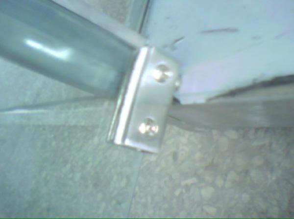 Place the complete secured lower left side door and hinge assembly into