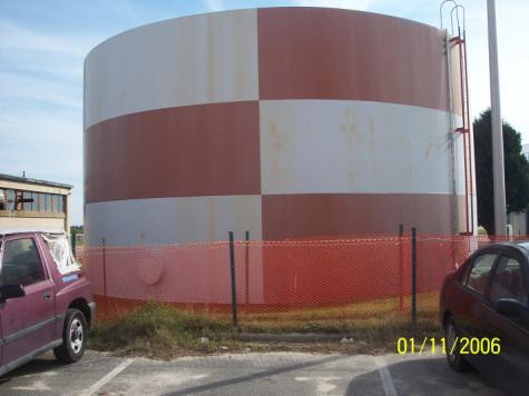 All signage was removed and reinstalled after the final coat was applied. Weld beads, collars on tanks, etc.