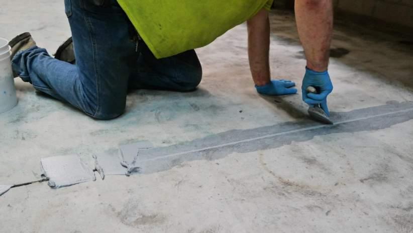 PlexiPatch QC is applied to this floor joint before the epoxy floor is installed If you need to repair cracks, holes or deviations in concrete, OR if you need to fill in floor joints before an epoxy