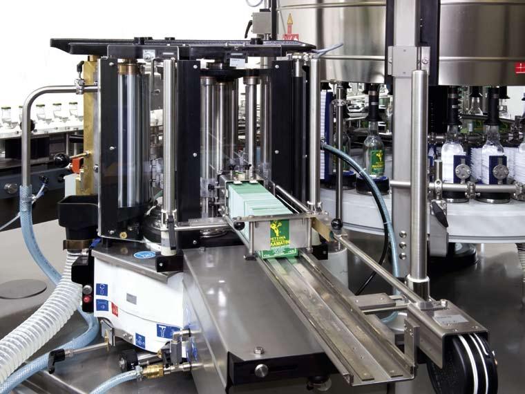 Cold-glue labelling station Synchronizing system: Pallet carousel and gripper cylinder turn in the same direction Pallet adjustment by cam roller running in the oil bath Gluing roller of hardened