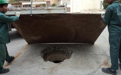 asphalt Revealing buried Manholes