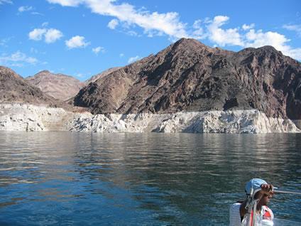 Decreased water levels at Lake Mead are readily visible along the shoreline.