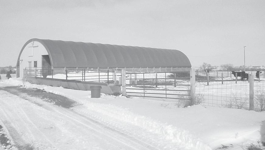 2 A hoop barn is a Quonset -shaped structure with sidewalls 4 to 10 feet high made of treated wood posts and wood sides.
