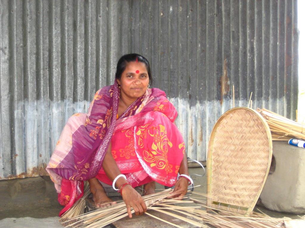 A member of the Sohag Mohila Samity (group) engaged in basket making,