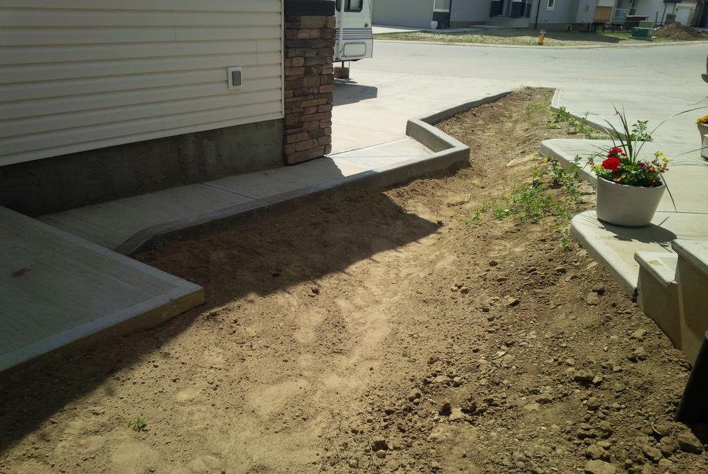 Retaining wall locations and elevations must be indicated on lot grading certificates A retaining wall at this