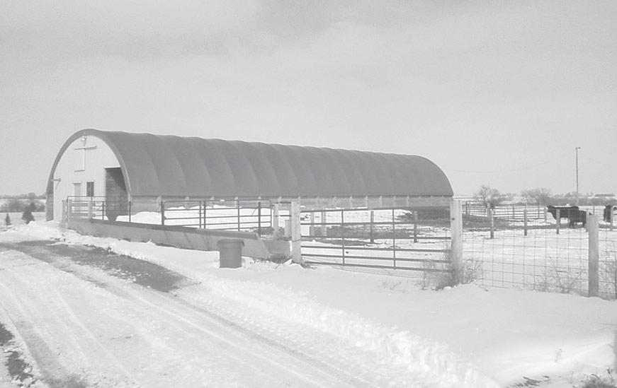 2 Polyvinyl tarp Hoop frame Shade or windbreak fabric Ratchet tie-downs (See Figure 11 for detail) Treated posts Treated boards Solid wall Figure 1. Basic components of a hoop barn.