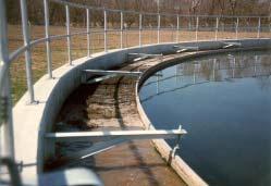 Design Features Peripheral-Feed Flow Pattern Wastewater enters the at the outer wall () and is directed along the narrow raceway formed by the skirt and the outer wall ().