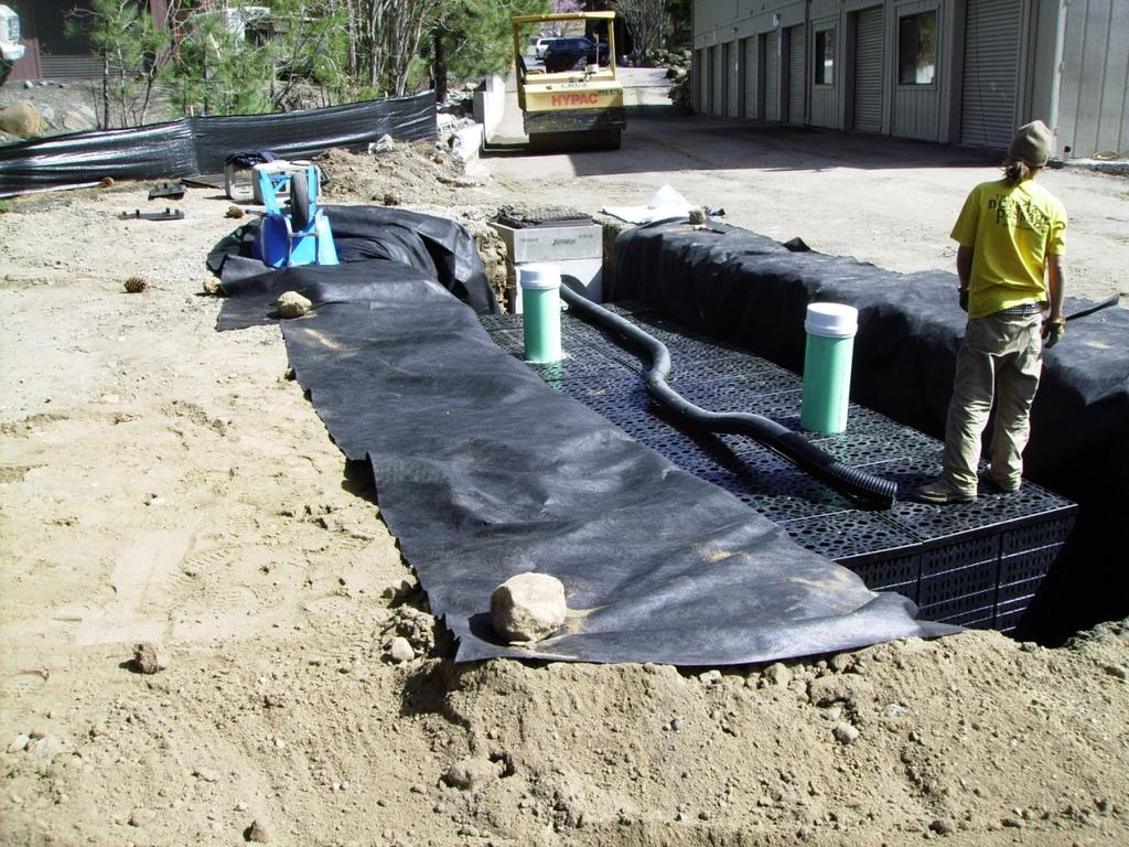 Commercial installation of prefabricated proprietary infiltration system with