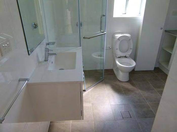 Bathroom (Above) - Custom cupboard joinery - Stylus Prima dual flush toilet suite - 300x300 tiles - Basin (upgrade) - Monda basin mixer - Monda 600mm single towel rail -