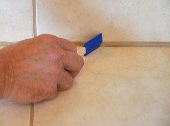 filled joint by exerting a regular pressure and scrape the excess sealant.