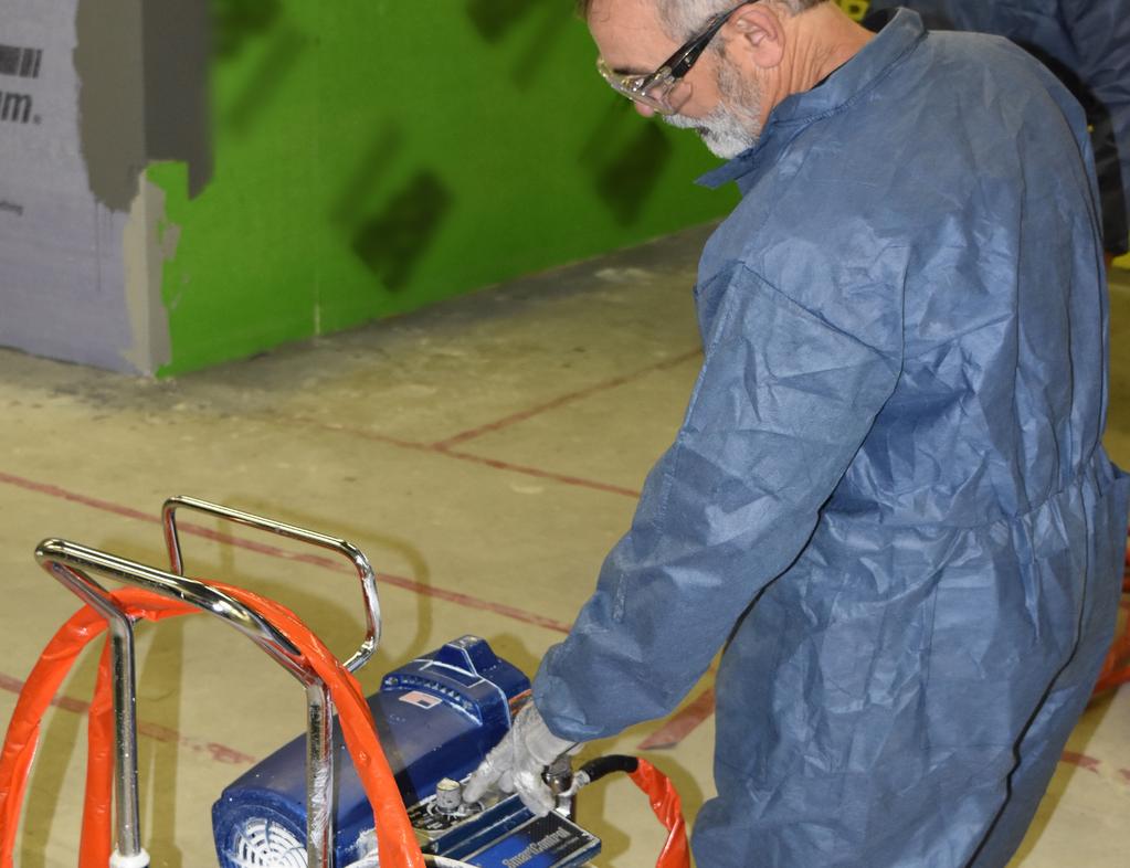 ASTM C1396) with airless spray equipment by roller, or brush to a consistent, minimum 12 wet mil thickness that is free of voids and pin holes.