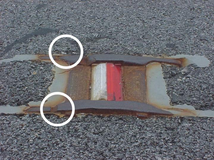 The epoxy adhesive does not fill all the voids around the casting (see illustration 2a, Section 350-5). c. The epoxy adhesive is not all around the casting and level with the roadway surface.