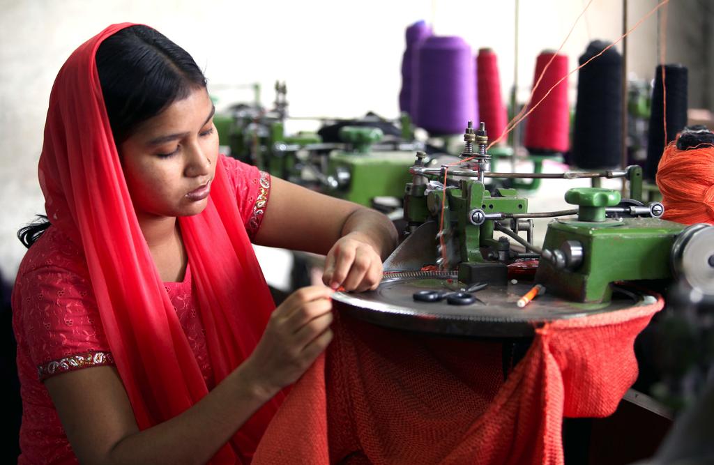 A young female worker in the Wool Tex Sweaters Limited in Dhaka, Bangladesh Source: Asian Development Bank to prices in China, what economists call the elasticity of substitution.