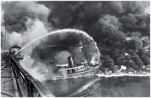 Figure 14.13 A river on fire. In 1952, the polluted Cuyahoga River in Ohio caught fire after a spark ignited the film of industrial pollution that was floating on the surface of the water.