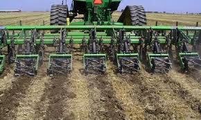 operations over a field is called combined tillage. PLOUGHING OF LAND Ploughing of land separates the top layer of soil into furrow slices.