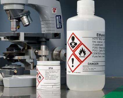 Are drums and secondary containers used to hold hazardous chemicals properly marked?