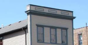 ROOFS GOAL: MAINTAIN HISTORIC ROOF AND PARAPET WALLS AND THEIR DISTINCTIVE FEATURES Example 1: Front façade is maintained; roof and parapet walls are