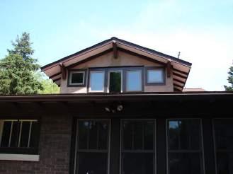 DORMERS & SKYLIGHTS GOAL: MAINTAIN THE FORM AND INTEGRITY OF HISTORIC BUILDINGS Example 1: This new dormer, installed on the rear elevation, fits in well with the architecture of the building DESIGN
