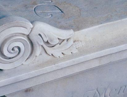 This marble tab in socket stone was leveled, reset, and cleaned. The before photo is on the left; after is on the right.