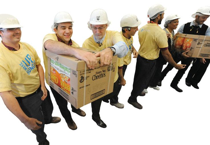 58 PART 1 INTRODUCTION l17/newscom In this photo, employees at a General Mills plant load boxes of cereal onto a community food bank truck as part of the company s commitment to Feeding America, a