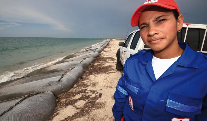 Integrating climate change into Red Cross Red Crescent programmes: from global commitments to local action Daili Rodriguez, a volunteer with the Colombian Red Cross, examines coastal erosion on the