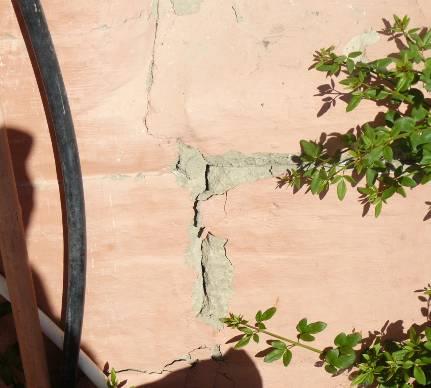 The most significant earthquake damage was at a point where part of a wall panel adjacent to a window remained attached to the bond beam noted as a diagonal crack on figure 4.