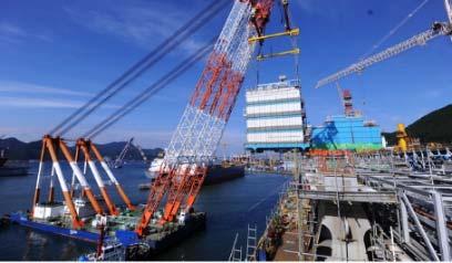 consortium with DSME FLNG towed to site