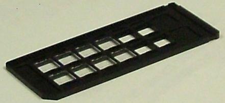 Figure 2-9 Shows plastic detector holder or slide, with 12 places for holding detectors It is also possible to change the number