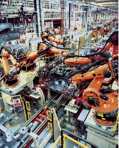 Wide range of material processing workcells In 1921 the word robot came into use having been derived from the Czech word robota, meaning hard labour and servitude.