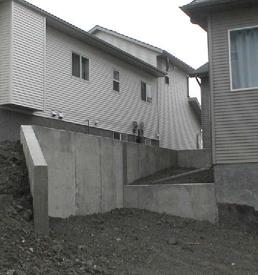 Retaining walls are also utilized to facilitate surface grading solutions related to un-intended circumstances, such