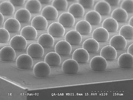 8 Chapter 1 Thin-film applications Fig. 1.8 SEM image of an area array of solder balls on a chip surface. performance and reliability.