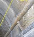 1 m (30 ft) below the top of the shaft and was installed in 1.5 m (5 ft) lifts to the top of the reinforced concrete base slab.