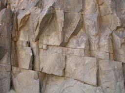 Water moves downward through the cracks in rocks and through tiny air-filled spaces between soil grains called pores.