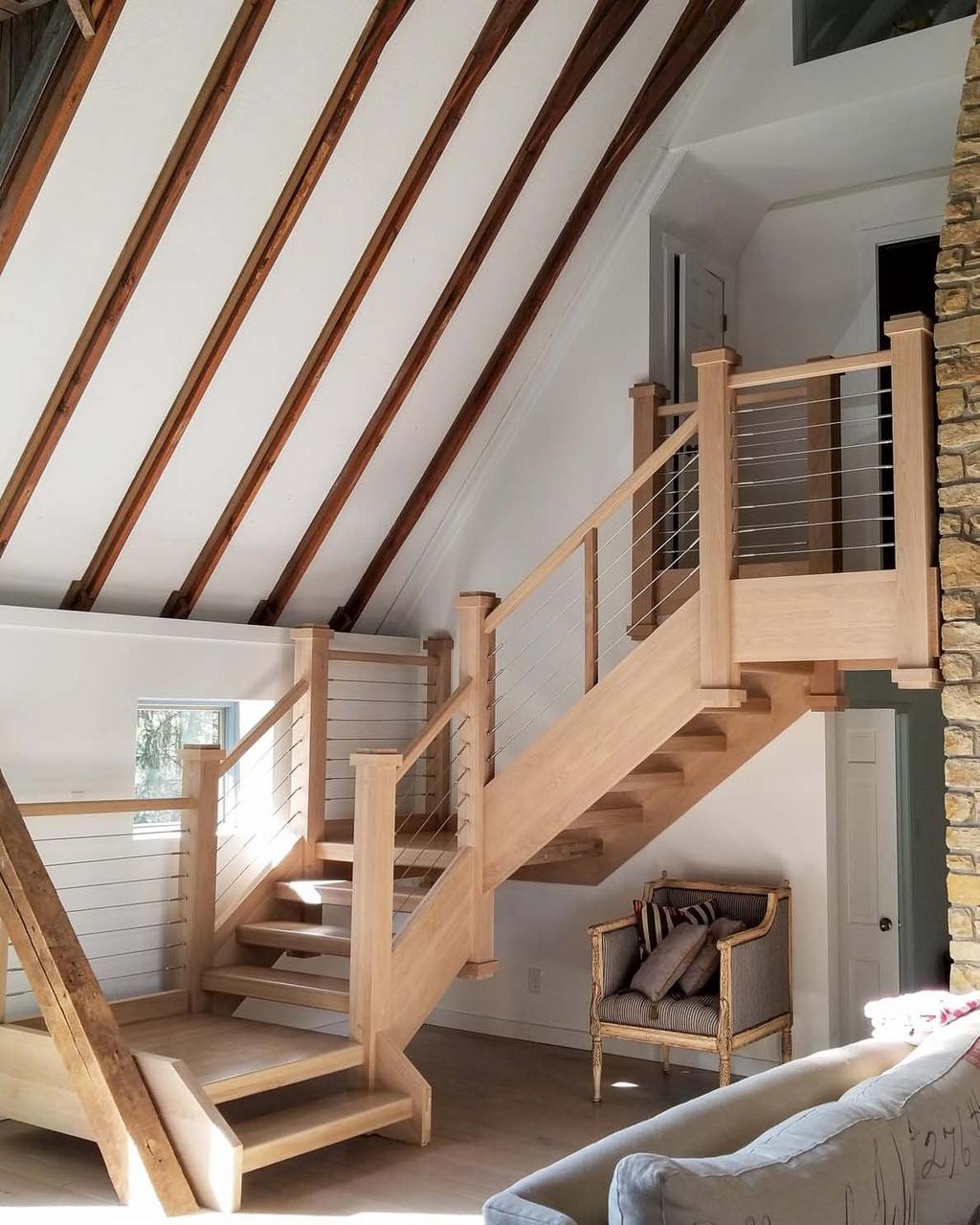 2018 StairCraft Awards Aesthetic value: Stairway provides a transitional flavored focal point to this barn that was renovated into a house.