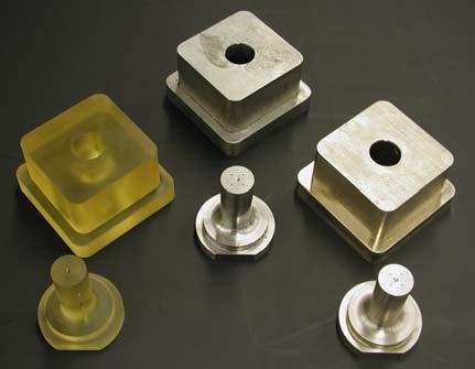 Figure 2: Canister part with vent holes and no taper. Figure 3: Core and cavity inserts, before final machining, made of SL 5170 (left), steel (center), and LaserForm ST-100 (right).