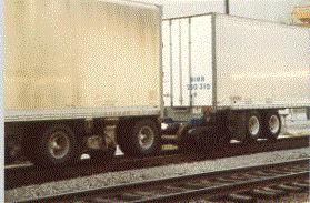 The trailer train has retractable wheels that allow it to move as a truck would on roads