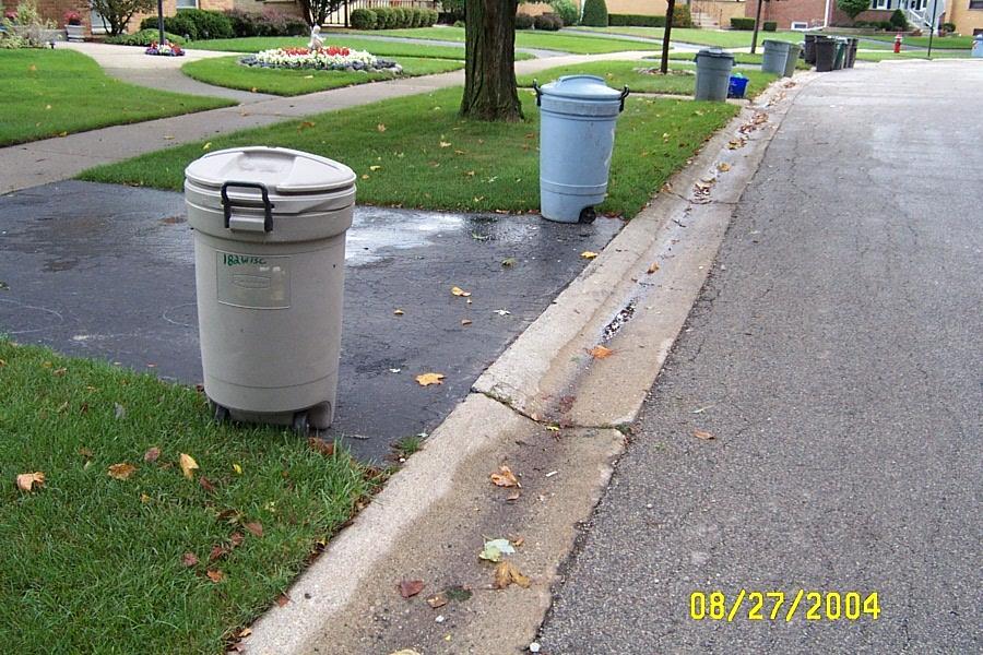The curb should be replaced as a depressed curb instead of a rolled curb.