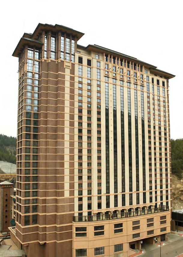 GFRC cladding is typically designed as horizontal panels that span floor to floor with gravity connections on one floor and lateral connections on the opposite floor.