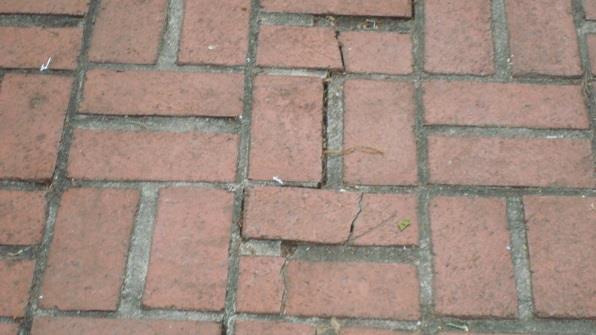 Recommend replacement of existing brick pavers and add to layout to address larger area needed for program functions.