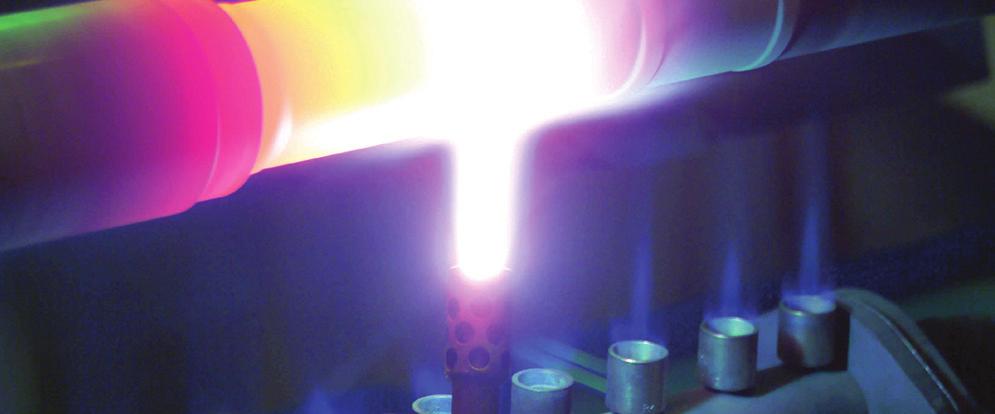 In flame-spraying, the powder particles are softened or melted in an oxyacetylene flame and transferred to a prepared workpiece by the expanding gases.
