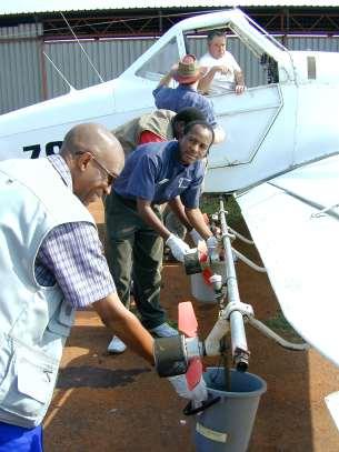 6 Fig.5. ICOSAMP delegates learning how to calibrate atomizer nozzles on the aircraft.