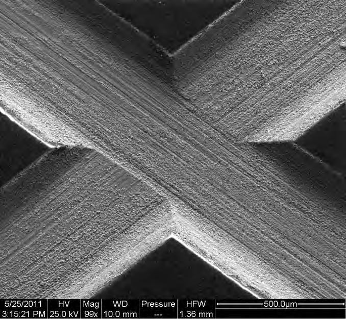 FIGURE 10 SEM micrograph of UNS K92580 0.5 mm scribe after 100 hour test per ASTM B117.