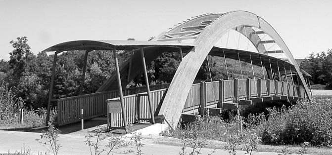 > The curved roof construction is made from corrugated aluminium.