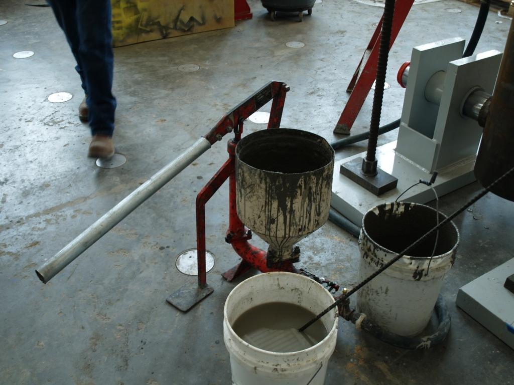 To assist in minimizing the possibility of air voids within the annular grout pocket, the decision was made to pump grout vertically from the bottom of the connection to the top where 1 diameter