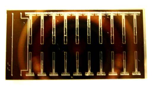 microsystem. The overall footprint of a single die was about 12 mm x 23 mm. The MEMS chip had two substrates, a glass substrate and a silicon substrate which were bonded by anodic bonding.