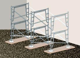 In order to assure stability, supported scaffolds must be set on base plates, mud sills, or other adequate firm foundation, unlike the example pictured at the left which no baseplates and is on an