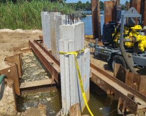anchor piles and modifying its nature from simply cantilevered to anchored structure.