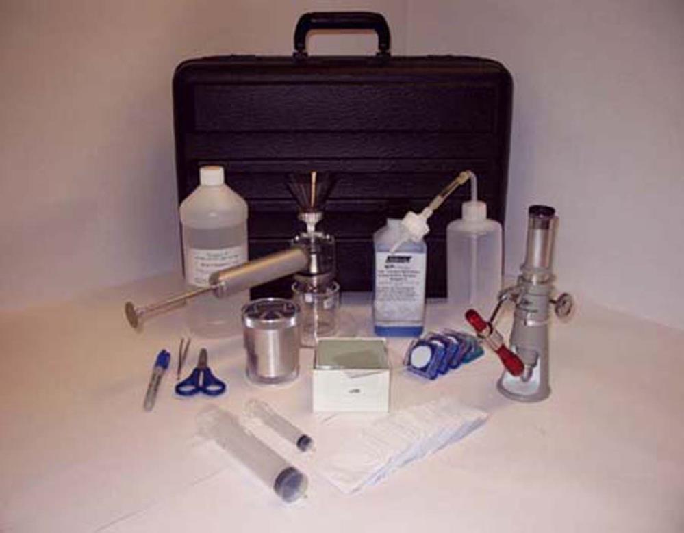 Using the vacuum pump contained in the kit, the fluid sample is drawn through a membrane patch.