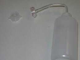 Once the patch is installed, fill the solvent bottle with Reagent A and place the lid assembly.