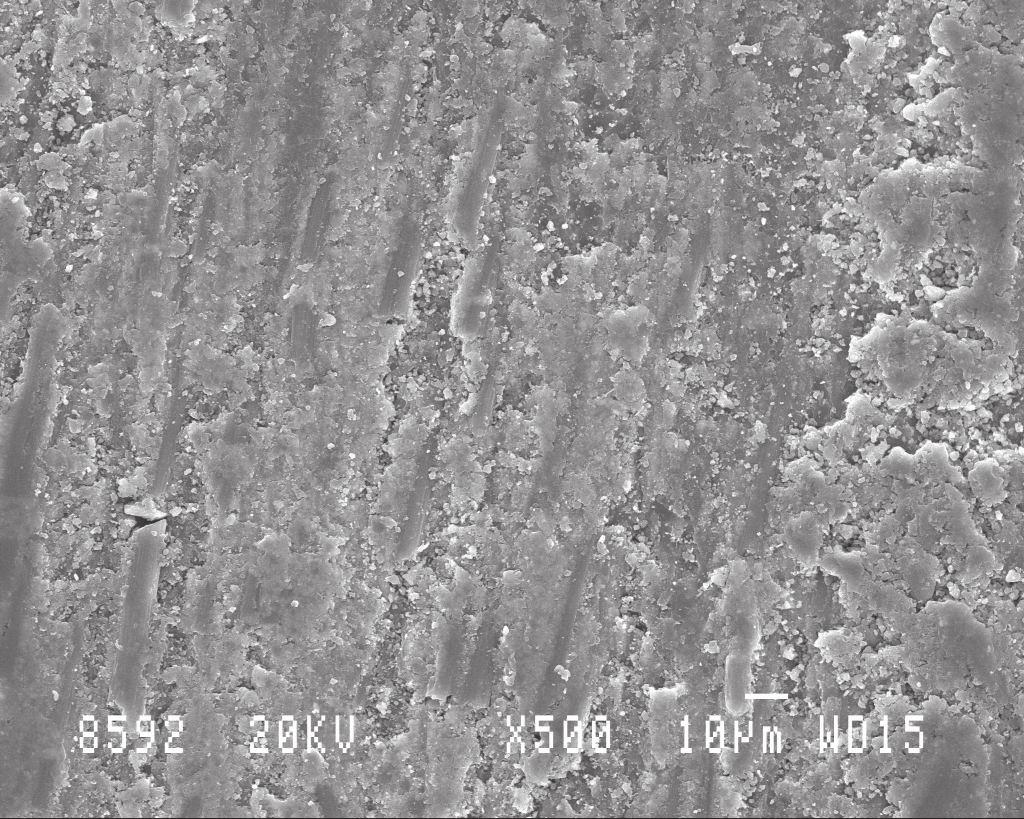 8 (a)-(b) show the worn surfaces of silane-treated SiC filled C-E samples abraded with 150 grit SiC paper at a load of 20 N and abrading distances 75 m and 225 m respectively. Figure 6.